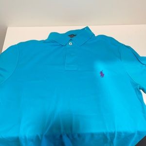 Ralph Lauren light blue men’s polo shirt with purple logo.  Great condition.